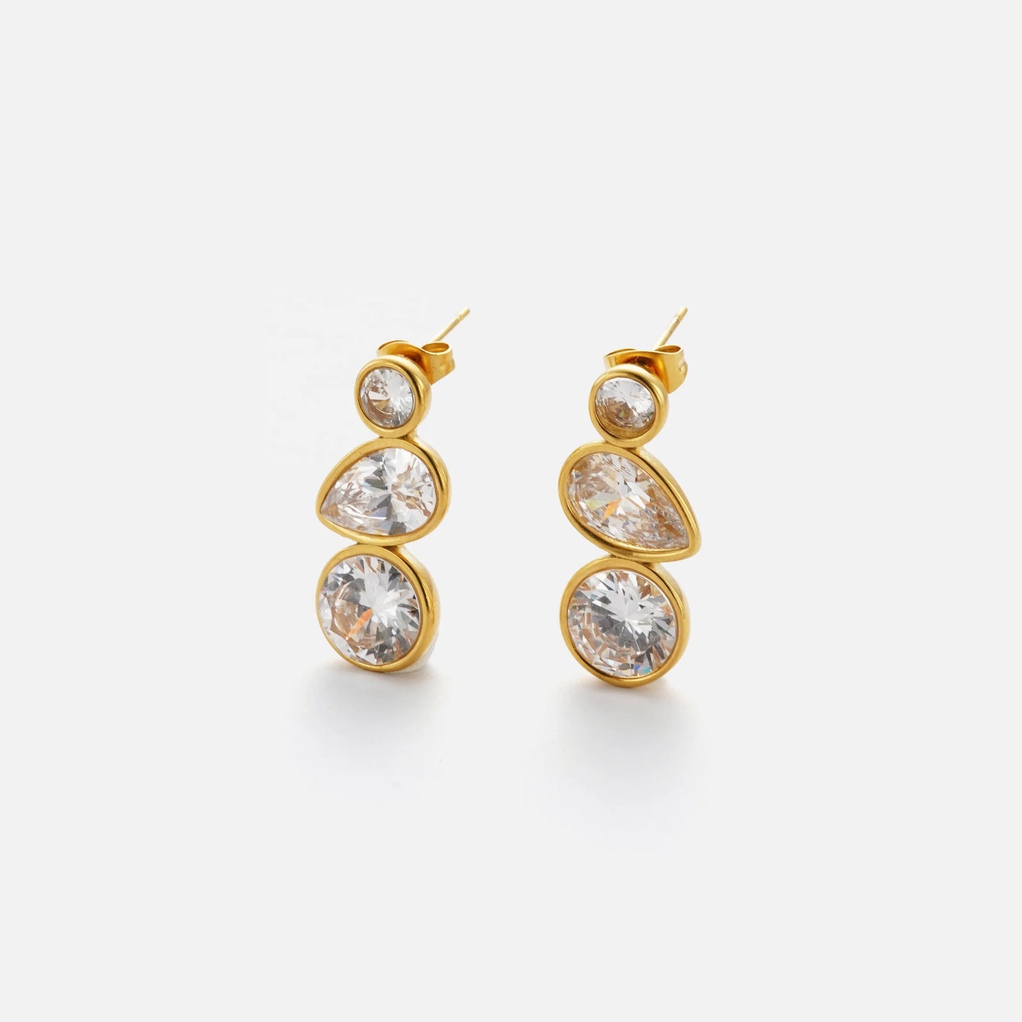 Elevate your style with the opulent gold and white diamond drop earrings, reminiscent of the delicate Iris flower. These exquisite earrings are waterproof, tarnish-free, and meticulously crafted with stainless steel and 18K gold plating.